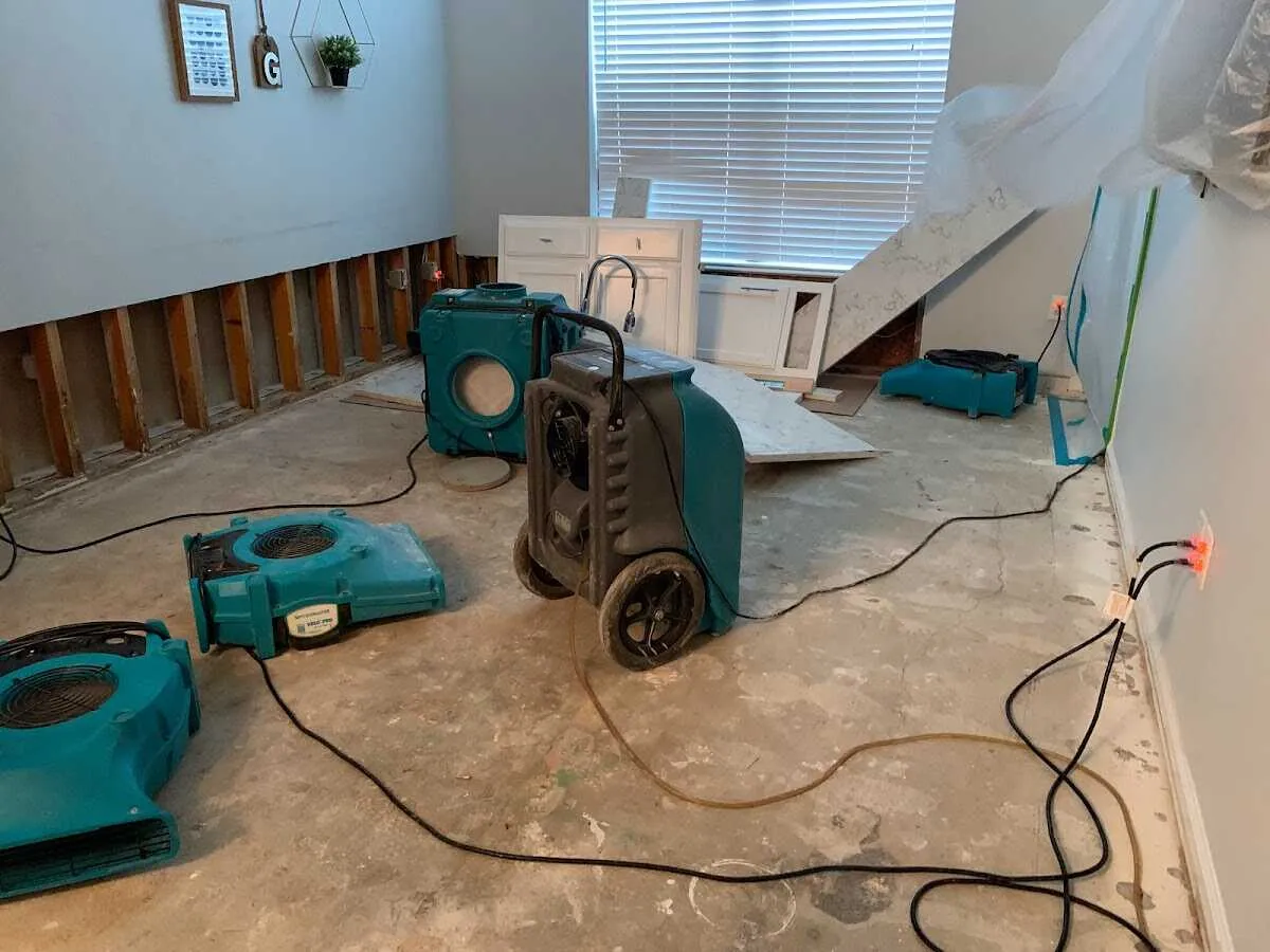 Dehumidifier in flood-cut room for Water Damage Restoration in Sutton
